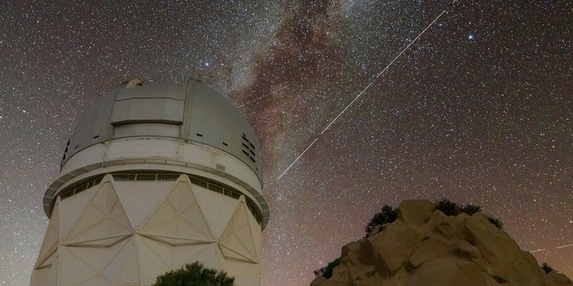 Trails in the night sky left by BlueWalker 3 are juxtaposed against the Nicholas U. Mayall 4-meter Telescope at Kitt Peak National Observatory in Arizona, a Program of NSF's NOIRLab. The breaks in the trail are caused by breaks between four 20 second exposures that were stacked to create this image.