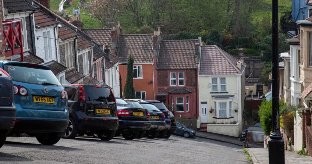 Brits on UK’s steepest street have to tie cars to lampposts and even ski down it