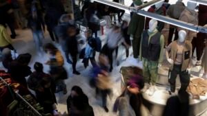 Shoppers are dipping into savings and going into debt. That could cause a holiday hangover