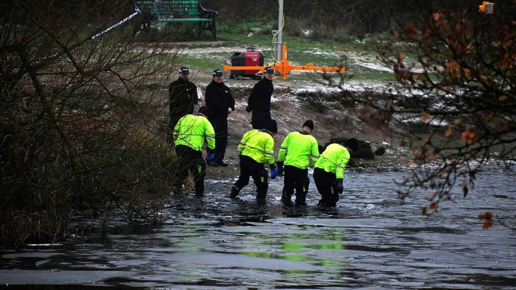 Three children die after falling into icy lake as Britain grapples with winter weather
