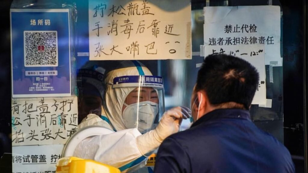 Queues form at fever clinics as China wrestles with COVID-19 surge