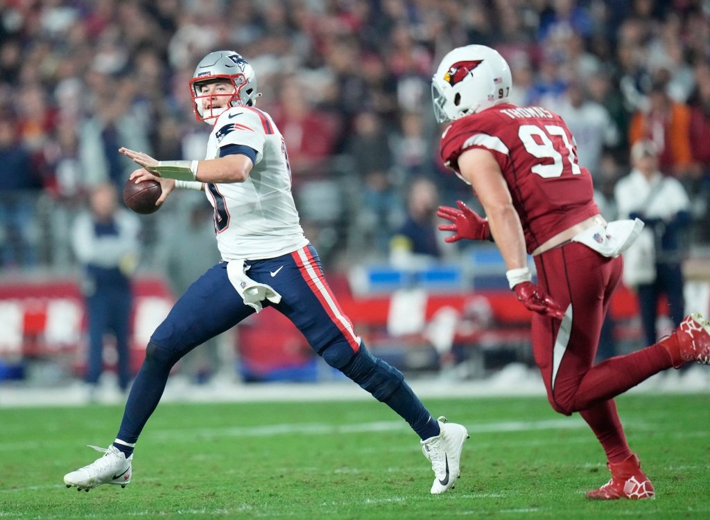 Mac Jones throws during the third quarter.