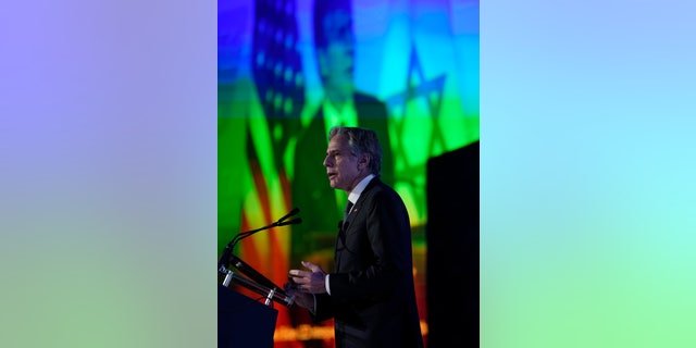 Secretary of State Antony Blinken speaks as his image is shown on a large screen behind him at the J Street National Conference at the Omni Shoreham Hotel in Washington, D.C., Dec. 4, 2022.