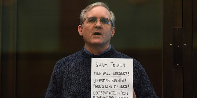 Paul Whelan, a former U.S. marine accused of espionage and arrested in Russia in December 2018, stands inside a defendants' cage as he waits to hear his verdict in Moscow on June 15, 2020.