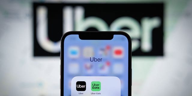 The Uber app application is seen on an Apple iPhone mobile phone.