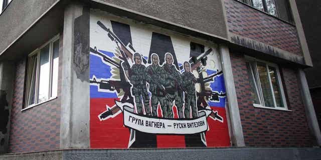 A mural depicting Russia's paramilitary mercenaries "Wagner Group" reading, "Wagner Group - Russian knights" on a building's wall in Belgrade, on Nov. 17, 2022.