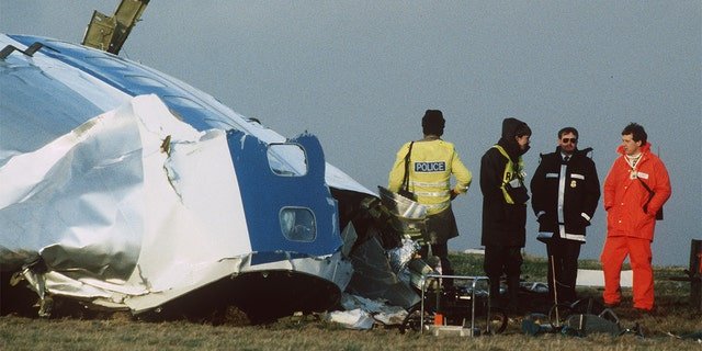 Scottish rescue workers and crash investigators search the area around the cockpit of Pan Am flight 103 in a farmer's field east of Lockerbie Scotland after a mid-air bombing killed all 259 passengers and crew, and 11 people on the ground.