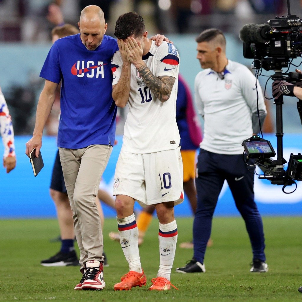 Gregg Berhalter consoles Christian Pulisic after the US was eliminated from the World Cup.