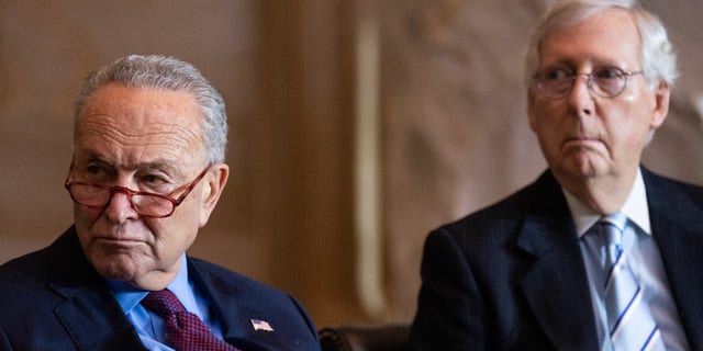 From left, Senate Majority Leader Chuck Schumer, D-N.Y., and Senate Minority Leader Mitch McConnell, R-Ky., attend the Congressional Gold Medal Ceremony in the Capitol Rotunda on Tuesday, Dec. 6, 2022.