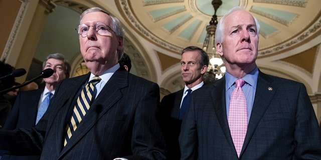 Sen. Mitch McConnell, R-Ky., left, Sen. John Thune, R-S.D., center, and Sen. John Cornyn, R-Texas, right, speak at a press conference on Capitol Hill.