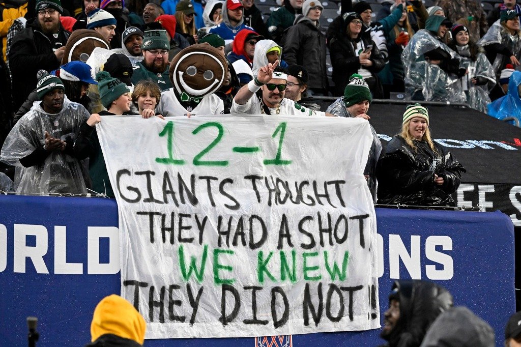 Philadelphia Eagles fans use a "12-1" banner to gloat after defeating the New York Giants at MetLife Stadium.