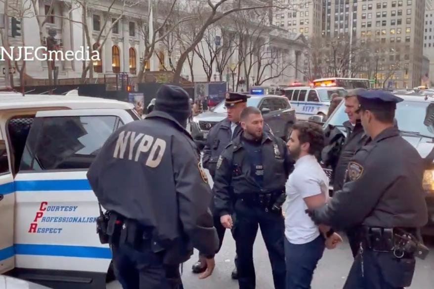A man who confronted a group of anti-Drag Story Hour protesters at a Manhattan library Saturday afternoon was arrested after allegedly getting into a tussle with an officer monitoring the demonstration, police said.