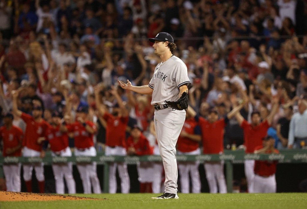 Gerrit Cole reacts after giving up a three-run home run to Rafael Devers.