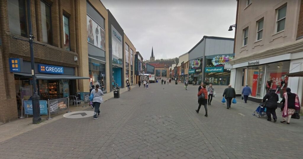 Man dies in town centre near Asda after group armed with weapons ambush him