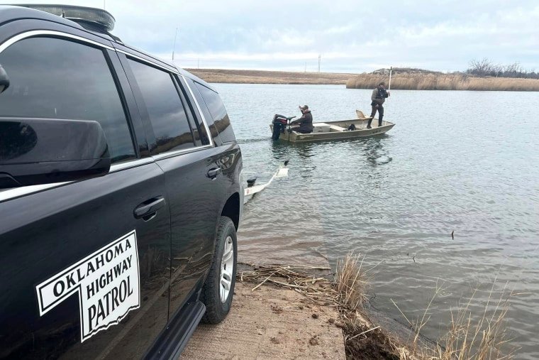 Oklahoma Highway Patrol troopers search a pond near Cyril, Okla, on Jan. 11, 2023, for Athena Brownfield.