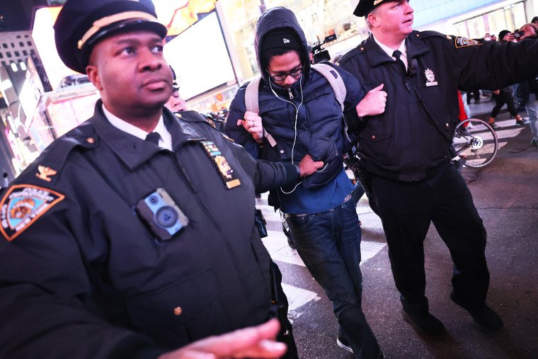 NEW YORK, NEW YORK - JANUARY 27: NYPD officers arrest a demonstrator as people protest the death of Tyre Nichols on January 27, 2023 in New York City. The release of a video depicting the fatal beating of Nichols, a 29-year-old Black man, sparked protests in NYC and other cities throughout the country. Nichols was violently beaten for three minutes and killed by Memphis police officers earlier this month after a traffic stop. Five Black Memphis Police officers have been fired after an internal investigation found them to be “directly responsible†for the beating and have been charged with “second-degree murder, aggravated assault, two charges of aggravated kidnapping, two charges of official misconduct and one charge of official oppression.†(Photo by Michael M. Santiago/Getty Images)