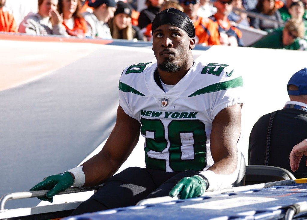 Breece Hall is carted off the field after suffering a torn ACL during the Jets' win over the Broncos.