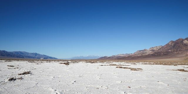 DEATH VALLEY, CA - JANUARY 6: A view of Badwater Basin as people visit in Death Valley National Park, California, United States on January 6, 2023.