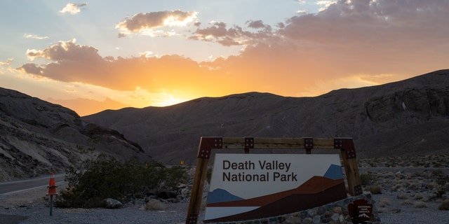 DEATH VALLEY, CA - AUGUST 24: The Death Valley National Park welcome sign is seen during sunset in Death Valley, California, United States on August 24, 2022.