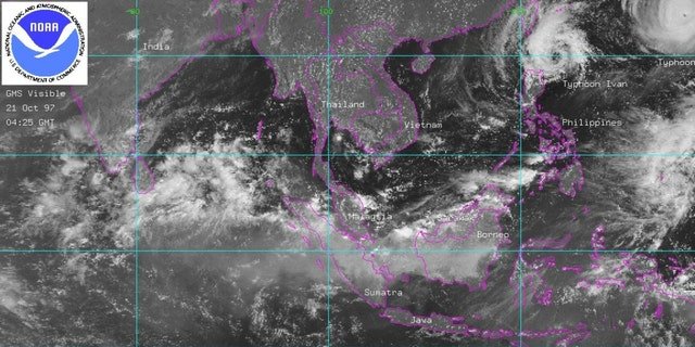 This satellite image released by NOAA 21 October shows smoke from massive forest fires over the Indonesian islands of Borneo and Sumatra.