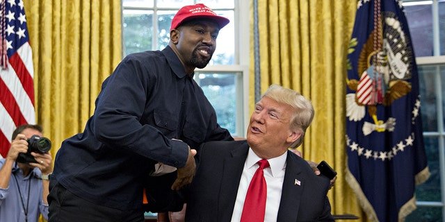 Rapper Kanye West, left, shakes hands with President Trump during a meeting in the Oval Office of the White House in Washington, D.C, Oct. 11, 2018. 