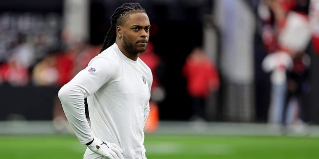 Wide receiver Davante Adams, #17 of the Las Vegas Raiders, stands on the field as he warms up before a game against the San Francisco 49ers at Allegiant Stadium on January 1, 2023, in Las Vegas, Nevada. The 49ers defeated the Raiders 37-34 in overtime.