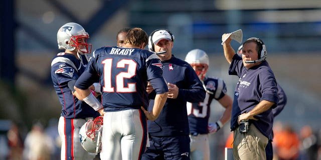 New England Patriots QB Tom Brady (12), head coach Bill Belichick and offensive coordinator Bill O'Brien on the field before a game against the Baltimore Ravens at Gillette Stadium in Foxboro, Mass., Oct. 4, 2009.