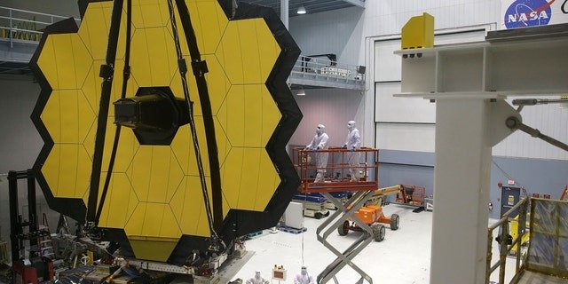Engineers and technicians assemble the James Webb Space Telescope at NASA's Goddard Space Flight Center in Greenbelt, Maryland.