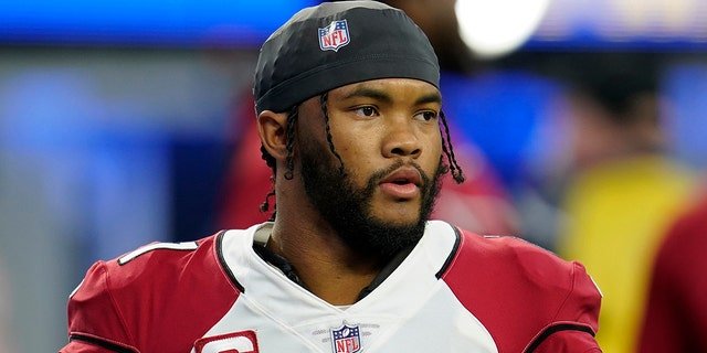 Arizona Cardinals quarterback Kyler Murray warms up before an NFL wild-card playoff football game against the Los Angeles Rams in Inglewood, California, Monday, Jan. 17, 2022.