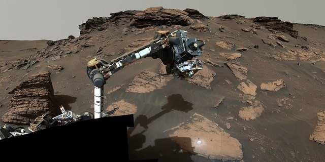 NASA’s Perseverance rover puts its robotic arm at ‘Skinner Ridge’ in Mars’ Jezero Crater.