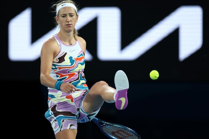 Victoria Azarenka kicks the ball in frustration at the Australian Open.