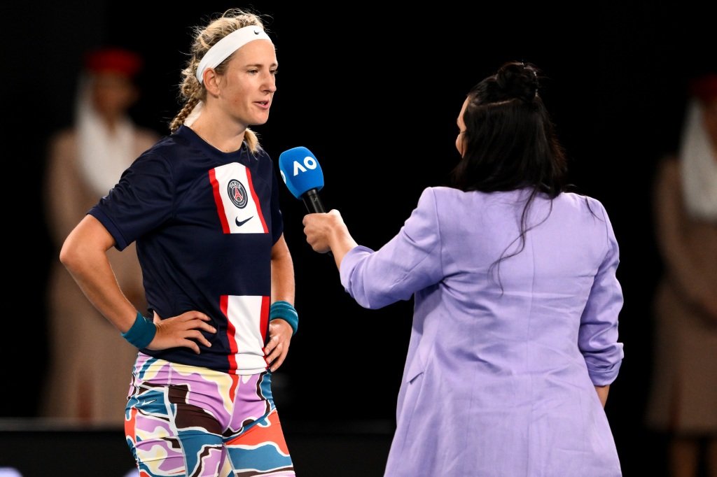 Victoria Azarenka does an interview after her win in the quarterfinals in the PSG shirt.