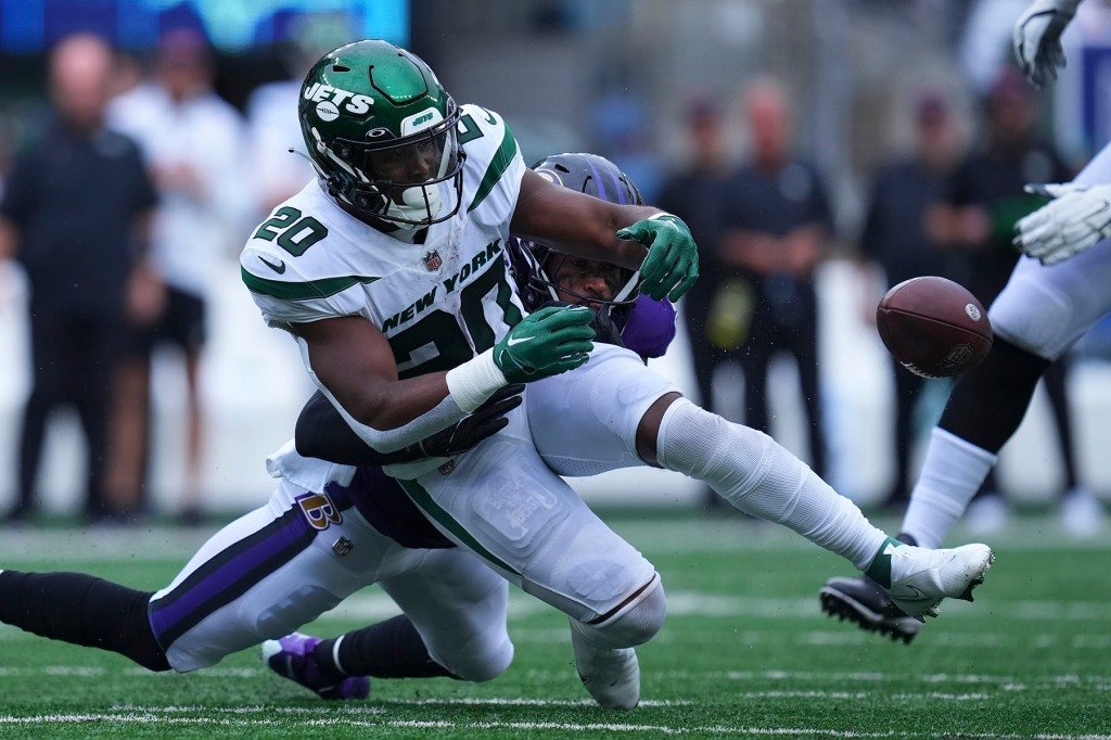 Chuck Clark #36 of the Baltimore Ravens forces a fumble against Breece Hall #20 of the New York Jets in the fourth quarter at MetLife Stadium on September 11, 2022.