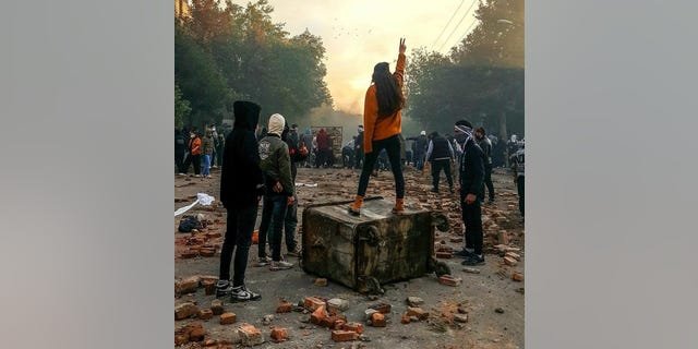 Demonstrators in Iran cry out in the streets.