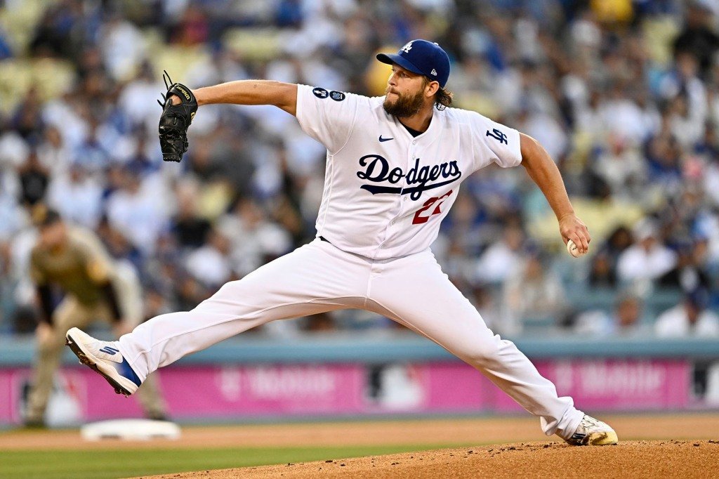 Starting pitcher Clayton Kershaw #22 of the Los Angeles Dodgers throws to the plate against the San Diego Padres in the first inning of Game 2 of a National League Division Series baseball game at Dodger Stadium in Los Angeles on Wednesday, October 12, 2022.
