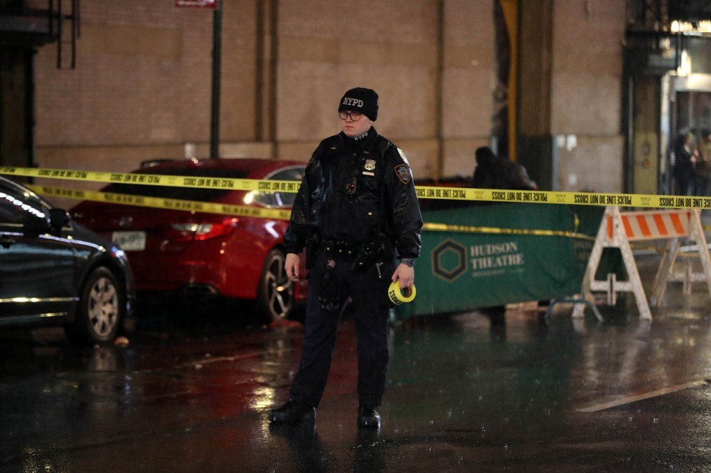 A police officer stands at the scene of Cheney's fatal plunge from the Hyatt Centric Times Square New York.