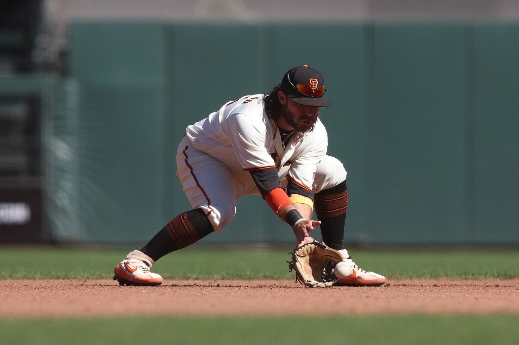 Brandon Crawford #35 of the San Francisco Giants fields the ball against the Arizona Diamondbacks at Oracle Park on October 02, 2022 in San Francisco, California.
