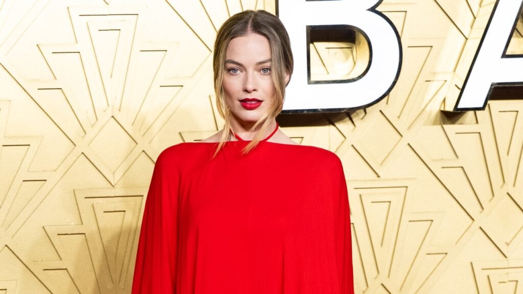 Margot Robbie Marks a New Style Direction in Red Hot Valentino