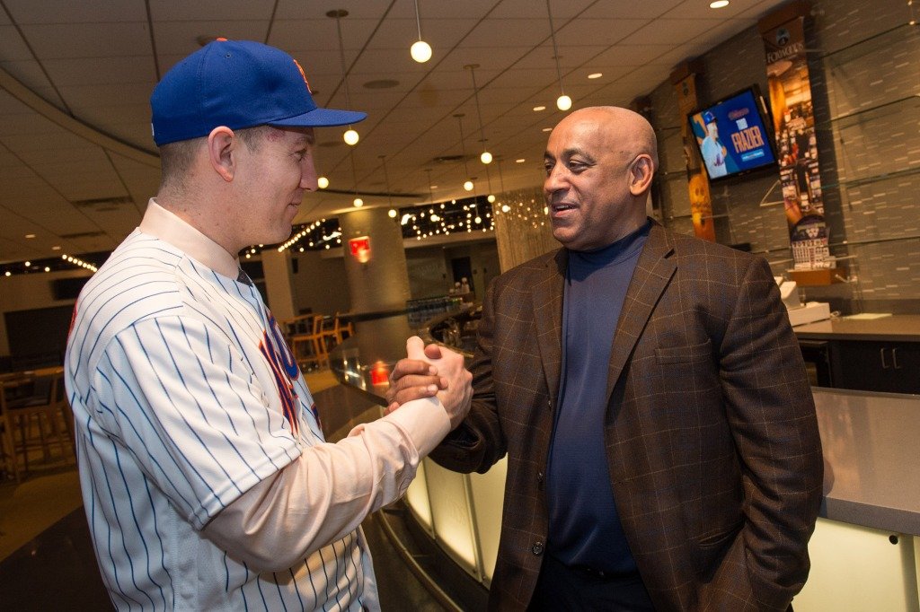 New York Mets assistant general manager Omar Minaya shakes hands with Todd Frazier at Citi Field on February 7, 2018.