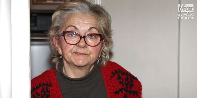Milanka Ljubicic opens the door to her apartment in Belgrade, Serbia on Monday, January 9, 2023.