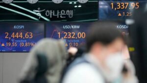 Live news: Dollar edges lower against Asian currencies following smaller Fed rate rise