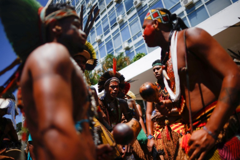 Indigenous people take part in a protest demanding government action to address the health crisis in their territories in Brazil