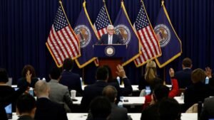 Fed approves smallest rate hike since March, in nod to improved inflation outlook