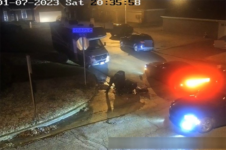 Memphis police officers surround Tyre Nichols as he lies on the ground on Jan 7.