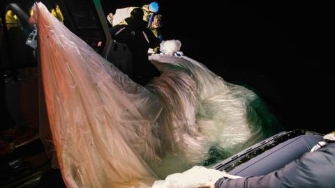 Sailors assigned to Explosive Ordnance Disposal Group 2 recover a high-altitude surveillance balloon off the coast of Myrtle Beach, South Carolina, Feb. 5, 2023. (U.S. Navy)