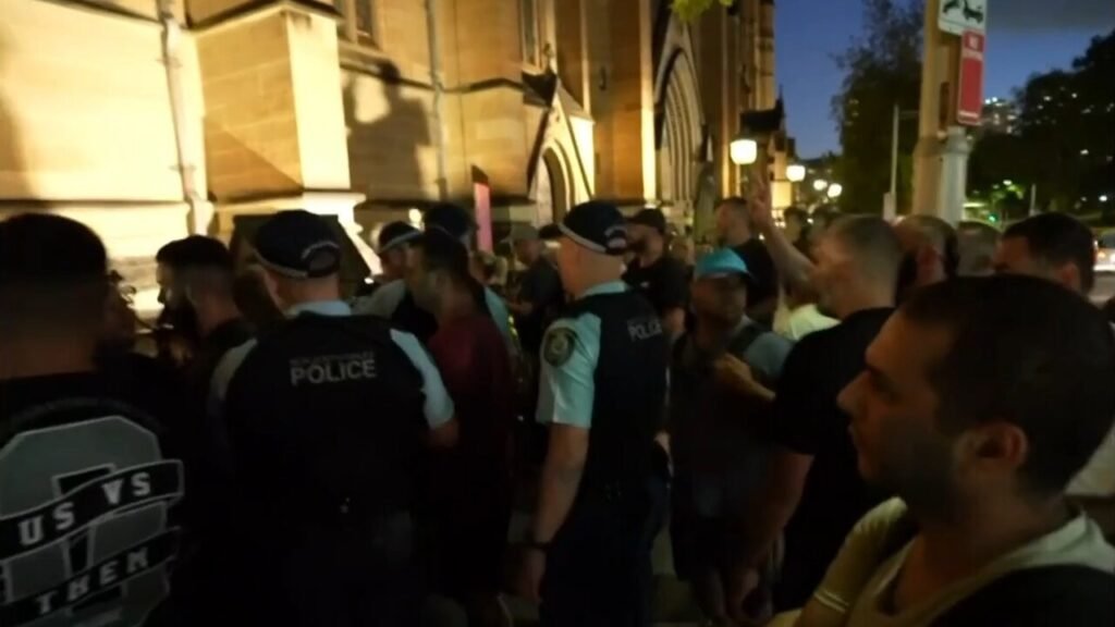 Cardinal Pell supporters clash with protesters at St Mary’s cathedral funeral overnight