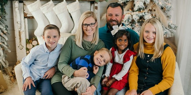 Co-owner of Geraldine Drugs, Brooke Walker (second from left), poses with her family at Christmas. For a full decade, Walker was helping Hody Childress, a veteran, use his own money to help neighbors pay their pharmacy bills. Childress didn't want anyone to know about it.