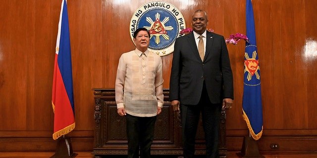 U.S. Secretary of Defense Lloyd James Austin III, right, poses with Philippine President Ferdinand Marcos Jr during a courtesy call at the Malacanang Palace in Manila, Philippines on Thursday, Feb. 2, 2023.