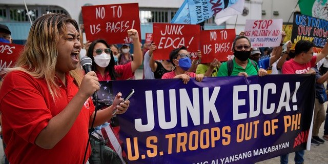 Demonstrators shout slogans as they protest against the visit of U.S. Defense Secretary Lloyd Austin outside Camp Aguinaldo military headquarters in metro Manila, Philippines on Thursday, Feb. 2, 2023.