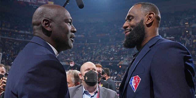 NBA Legends Michael Jordan and LeBron James shake hands during the 2022 NBA All-Star Game Feb. 20, 2022, at Rocket Mortgage FieldHouse in Cleveland.